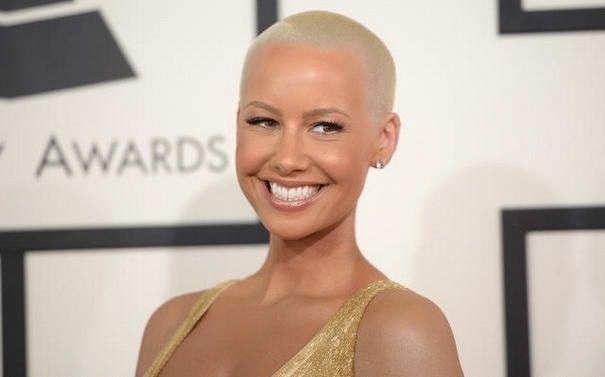 Amber Rose shows off her perfect curvy body in brown jumpsuit at Book Promotion 
