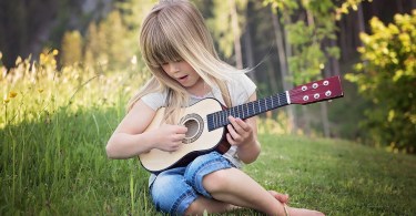 How does the guitar inspire the love of music in every child?